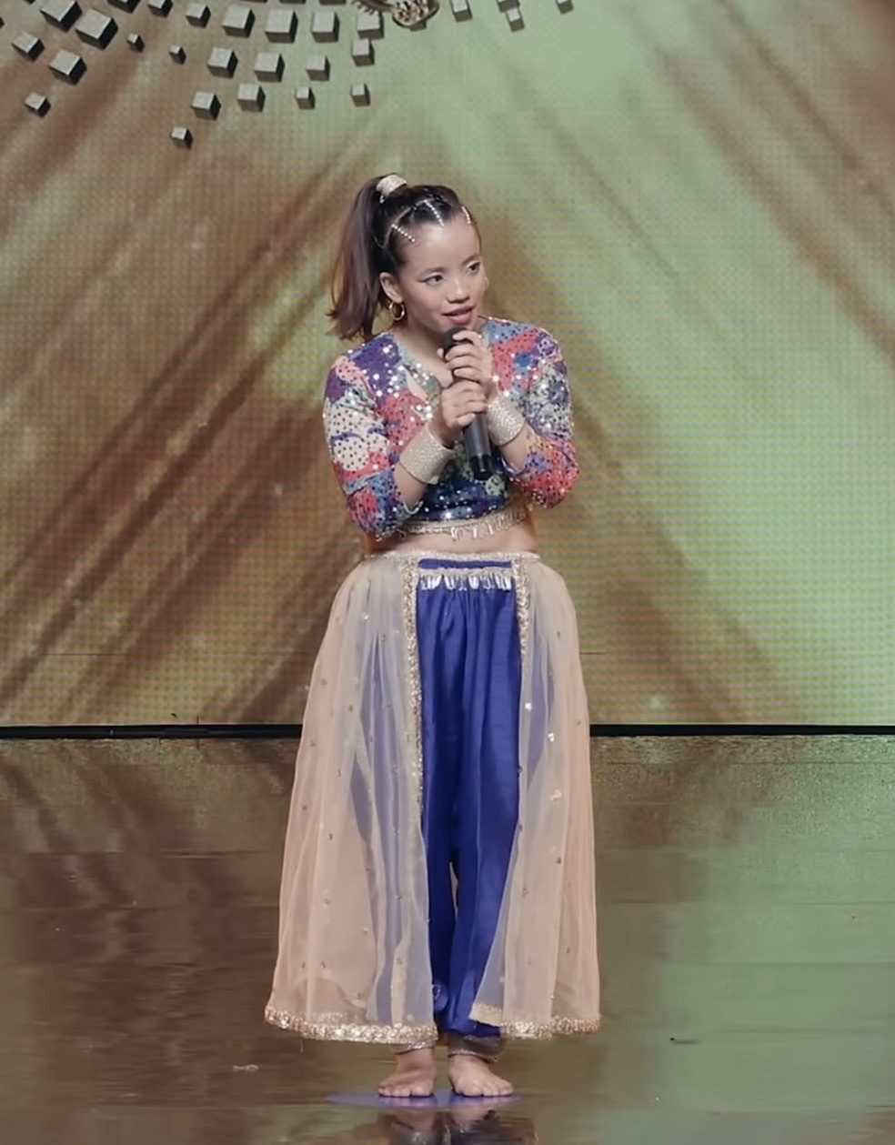 Amrita Rai speaking on stage in performance costume during Mero Dance Universe Season 2